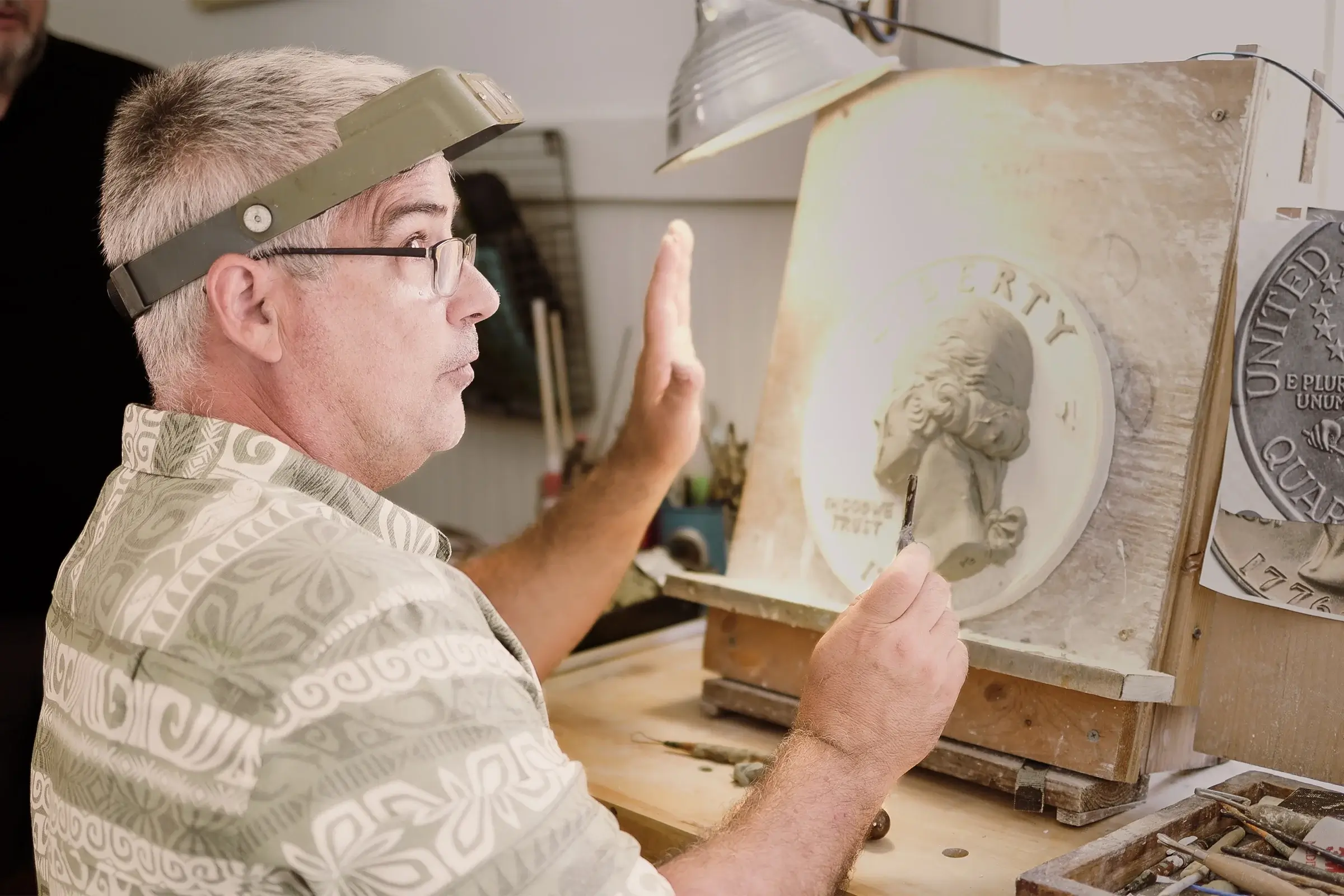 Michael Gaudioso working on the Bicentennial Quarter clay model in his studio