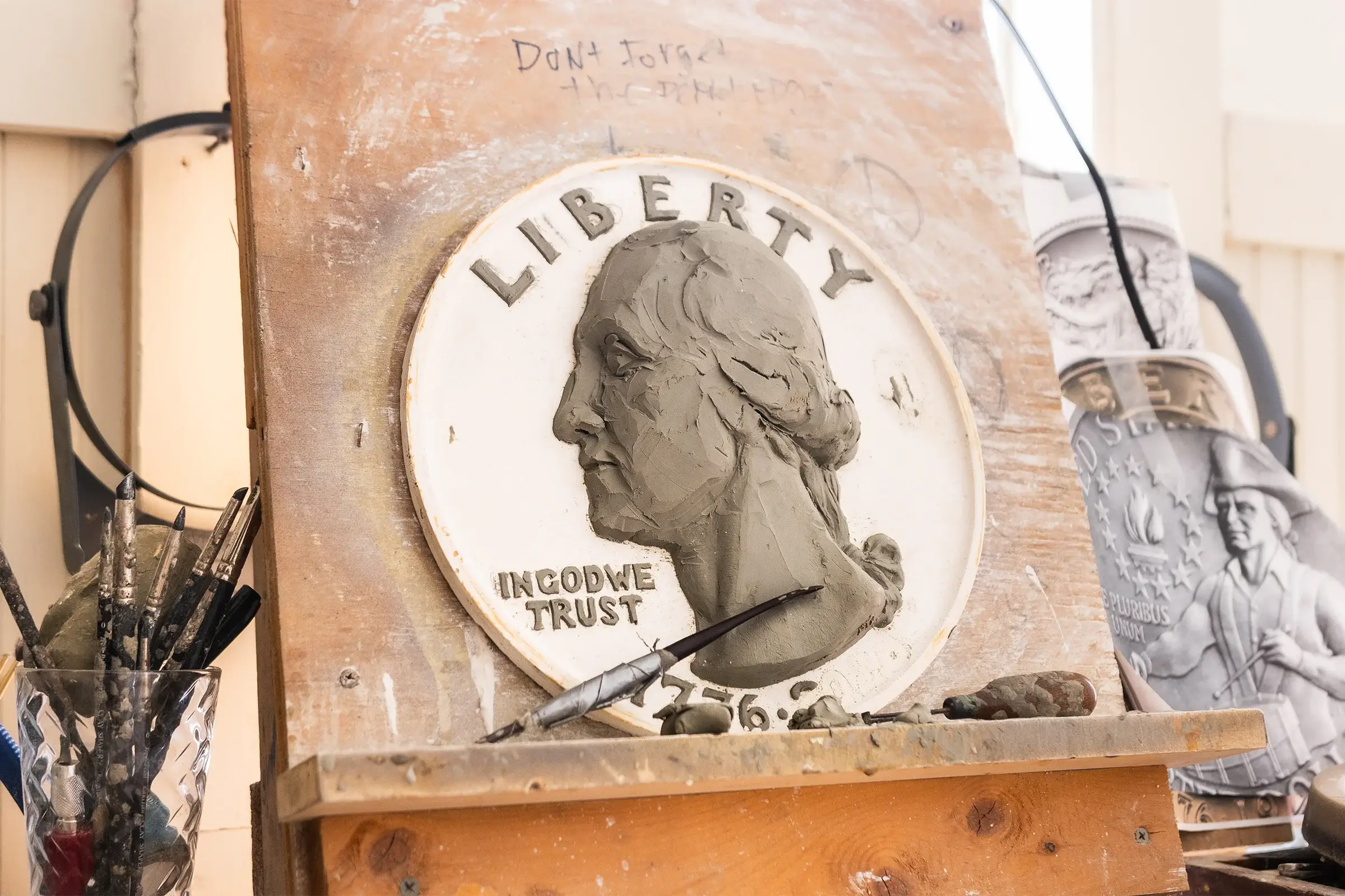 Close-up of the Bicentennial Quarter clay portrait in Michael Gaudioso's studio